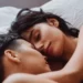 Why It's Good to Sleep Next to Your Partner - A man and woman embracing in bed, positively impacting mental health.